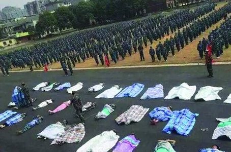 Weird punishment: College freshmen bathe in sunshine in quilts during military training