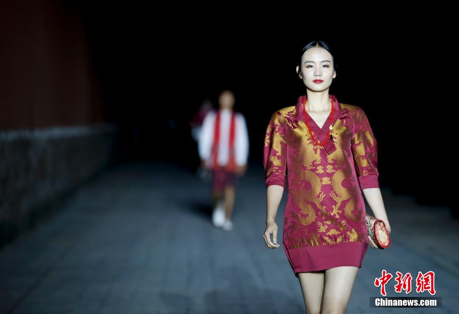 Fashion show staged in Forbidden City at night