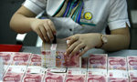 US softens criticism of yuan valuation