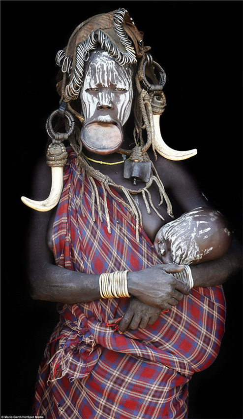 Photographer spends seven years taking intimate portraits of African tribes 