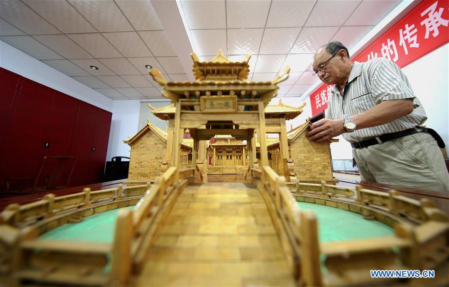 70-year-old makes handicrafts using discarded wooden sticks