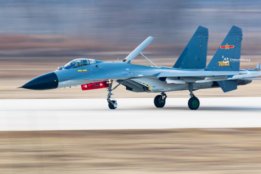 J-11B fighter jet flies past the sun