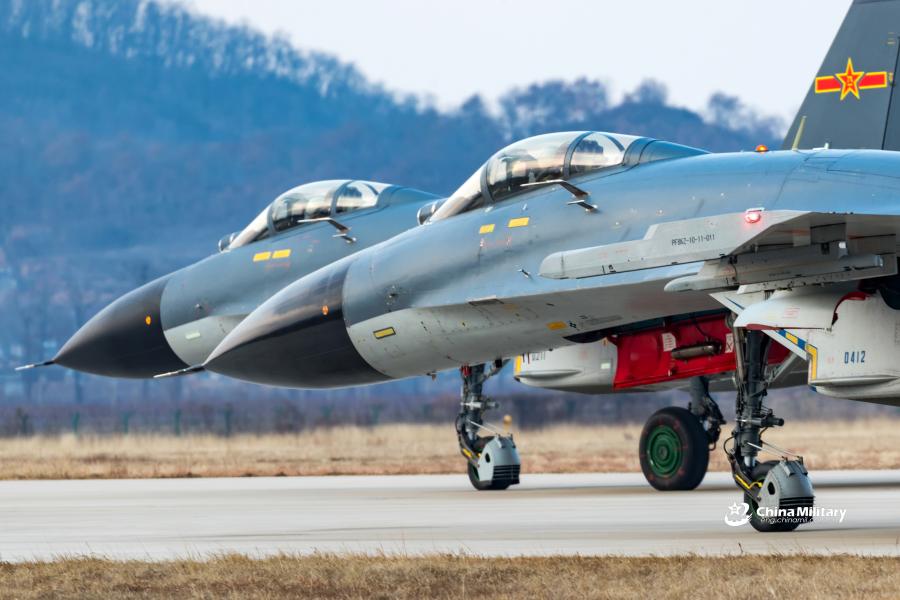 J-11B fighter jet flies past the sun