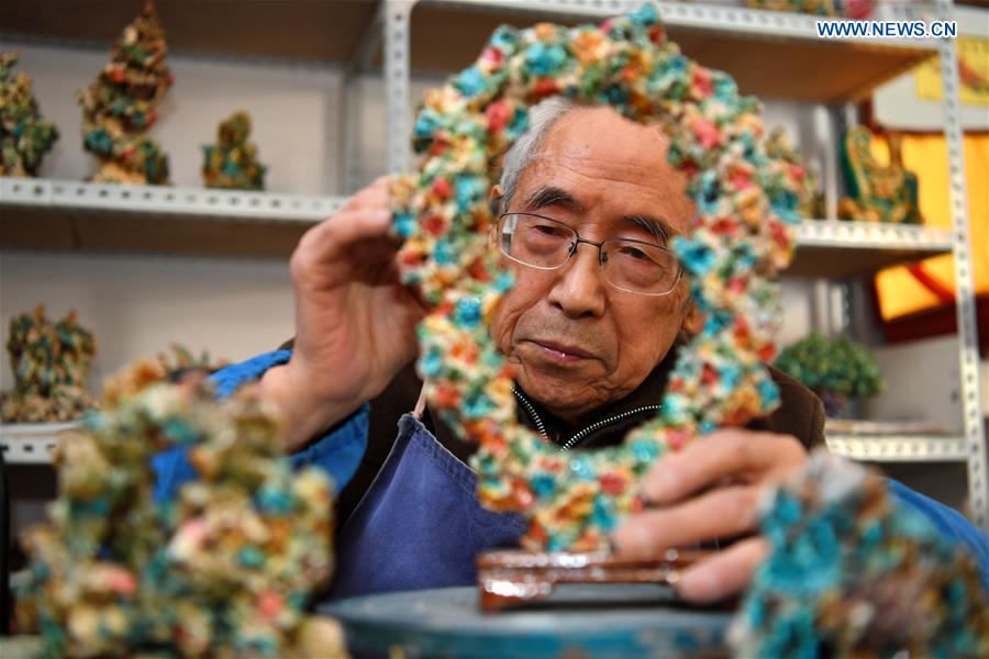 Inheritor of coloured glaze firing skill transforms waste into artwork in China's Shanxi