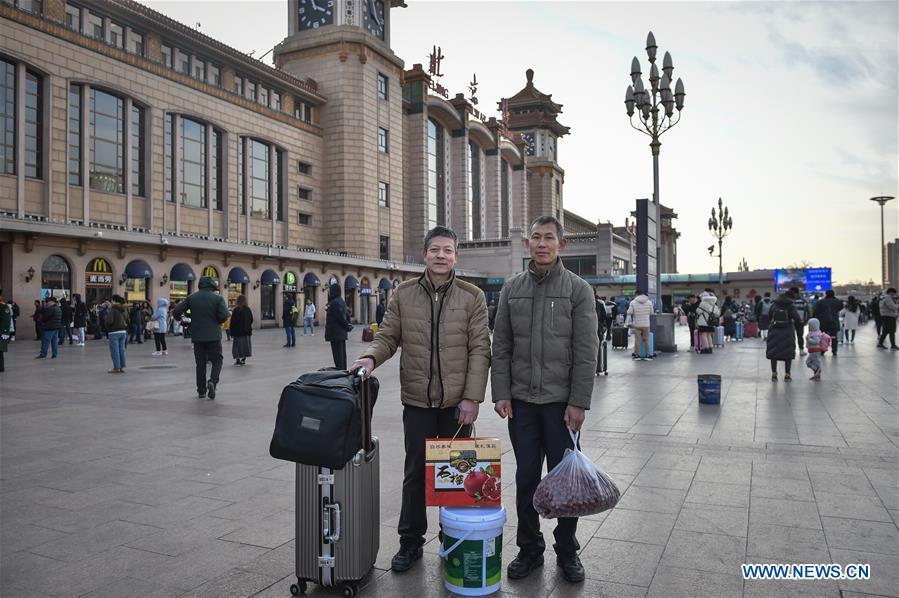 Passengers bring gifts for families as they head home for Spring Festival
