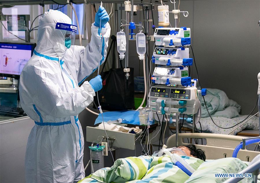 Medical workers take care of patients in Wuhan