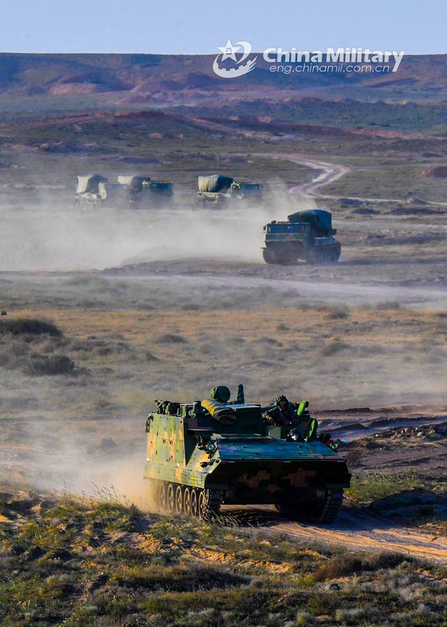 Armored vehicles en route to training field