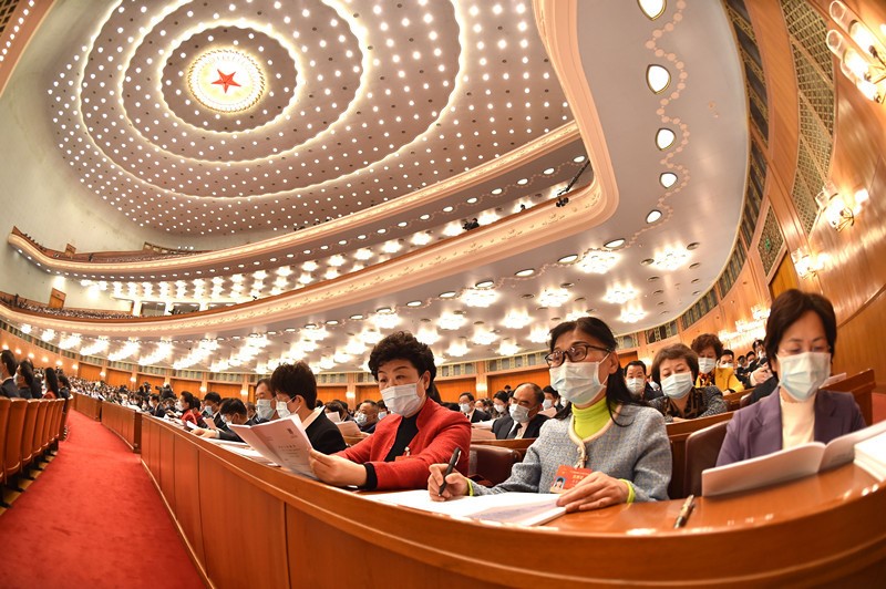 How are China's economic, social development goals for 2021 determined?