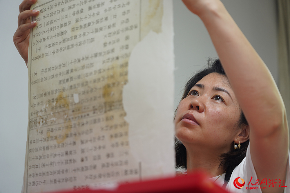 Repairers bring damaged ancient books back to life