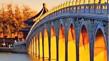 Golden sunlight filters through the Seventeen-Arch Bridge