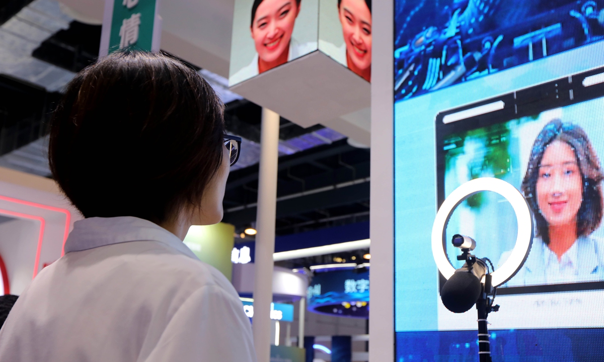 Vsitors experience artificial intelligence that detects and interprets human emotional signals at 2021 WAIC in Shanghai on Wednesday. Photo: Chen Xia/GT