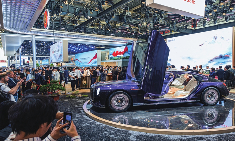 Visitors take photos of the Hongqi Golden Sunflower Premium model at the 2024 Beijing International Automotive Exhibition on April 25, 2024. Photo: Li Hao/GT