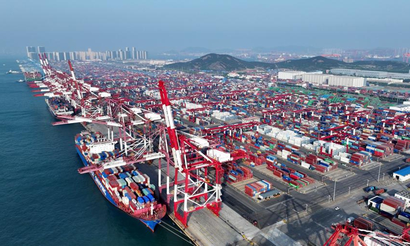 An aerial drone photo taken on April 30, 2025 shows cargo ships berthing at a container dock of Qingdao Port in Qingdao, east China's Shandong Province. This year, Qingdao port has actively expanded its international shipping routes, especially for the Association of Southeast Asian Nations (ASEAN). Photo: Xinhua